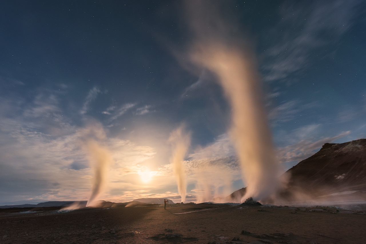 Plumes of steam rise into the air as the geothermal processes at Námaskarð make their way to the surface.