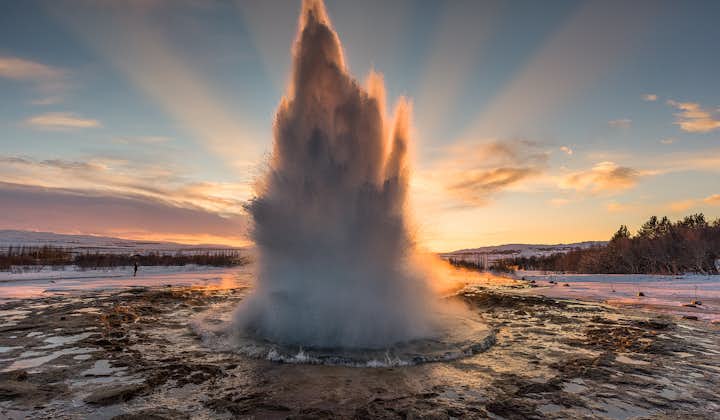 Capture the moment the hot spring Strokkur erupts at Geysir geothermal area.