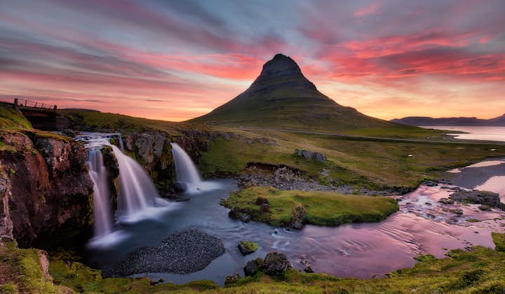 One of the jewels in the crown of the Snæfellsnes peninsula is the photogenic Mount Kirkjufell, especially under the colourful shades of the Midnight Sun.