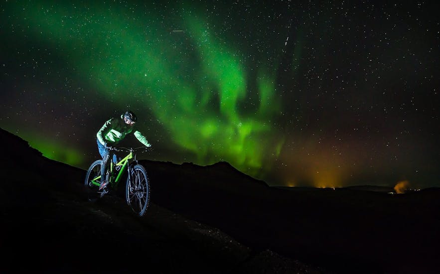 Cycling beneath the Northern Lights Aerial view of Iceland - Photo by Snorri Thor Tryggvason