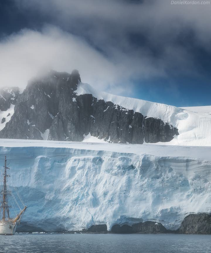 The Greg Mortimer sails along the Antarctic ice shelf.
