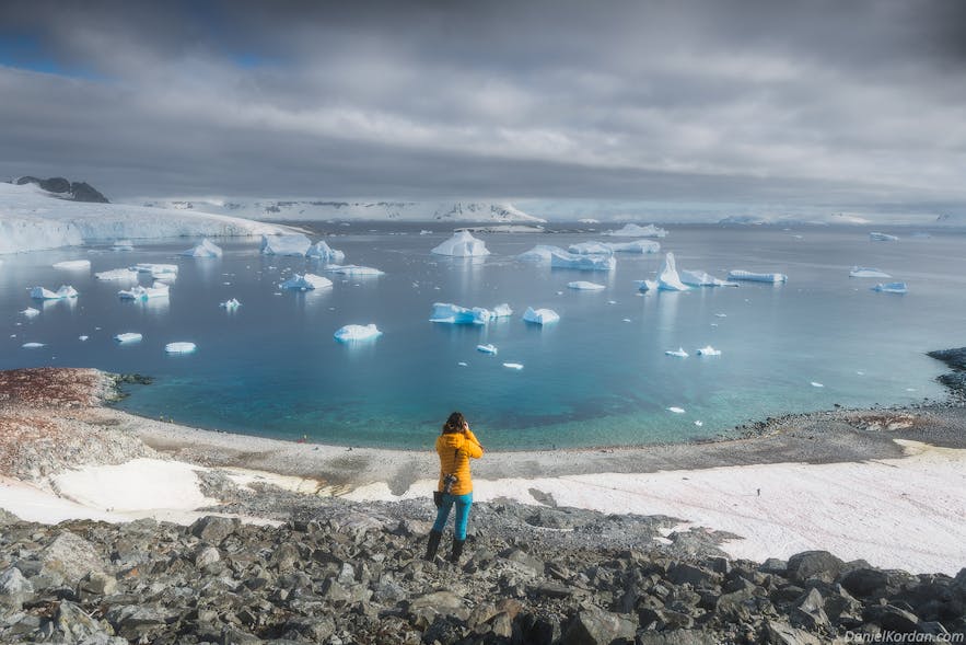 A photographer snaps on a beautiful day in Antarctica.