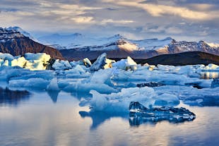 Jokulsarlon Glacier Lagoon showcasies majestic floating icebergs against a backdrop of stunning natural beauty.