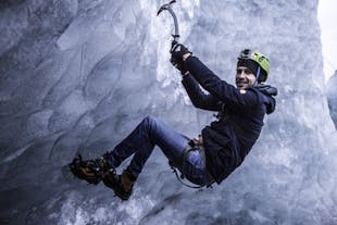 A man conquering the icy heights of the glacier.