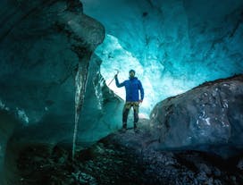 Exploring the enchanting Blue Ice Cave, a moment of awe in nature's frozen masterpiece.