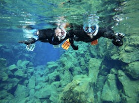 Experiencing pure bliss as they explore the breathtaking underwater world of Silfra.