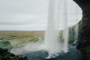 Refreshing cascade of Seljalandsfoss, a breathtaking waterfall you can walk behind.