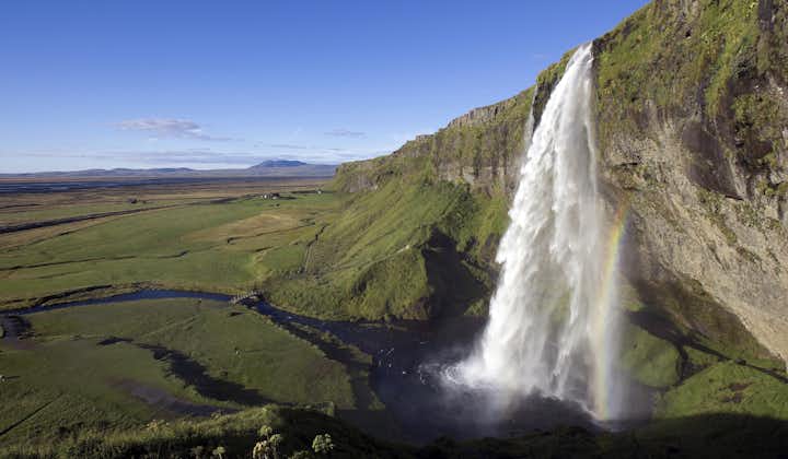 Seljalandsfoss is a picture-perfect waterfall on Iceland's South Coast with a path encircling it.