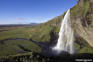 Seljalandsfoss is a picture-perfect waterfall on Iceland's South Coast with a path encircling it.
