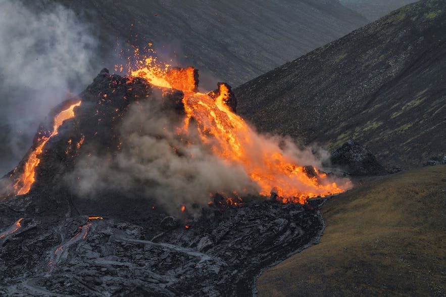 Lava pours like a waterfall from Geldingadalur's crater.