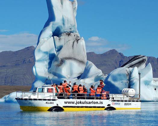A group of tourists enjoying a boat tour in the Jokulsarlon glacier lagoon.