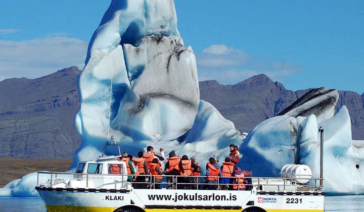 A group of tourists enjoying a boat tour in the Jokulsarlon glacier lagoon.