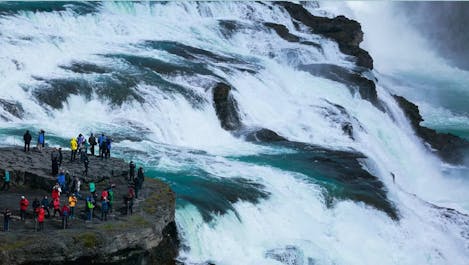 Gullfoss Waterfall: A majestic cascade fed by Iceland's Langjökull glacier, forming the stunning 'Golden Falls'.