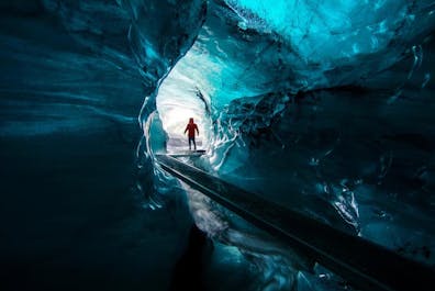 Explore the mystical ice caves beneath the formidable Katla Volcano, where fire and ice unite in an otherworldly spectacle.