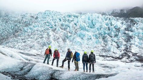 Embark on a glacier hike to explore the enchanting world of Solheimajokull's icy landscapes.