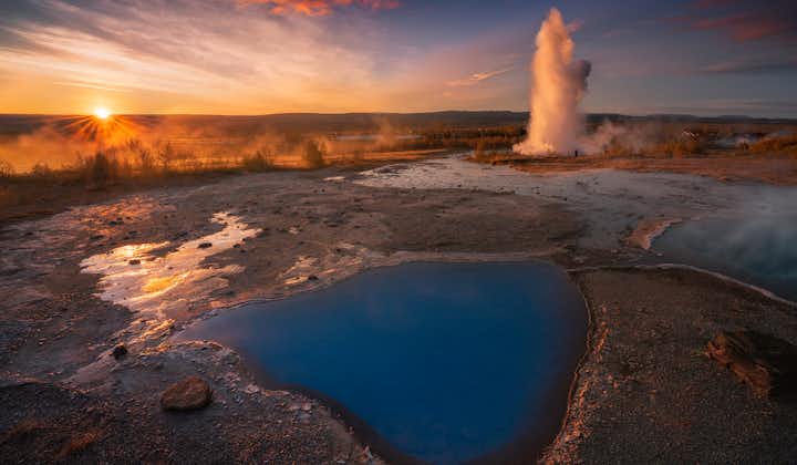 The Geysir geothermal area looks stunning under the colors of the setting sun.