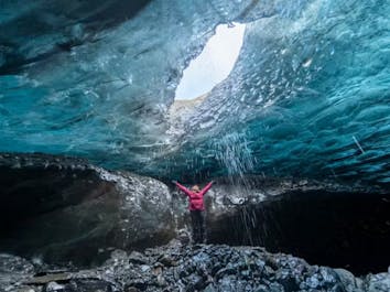 Explore the mesmerizing depths of a stunning blue ice cave, where nature's frozen artistry comes to life.