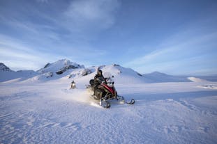 Driving or riding in a snowmobile is a magnificent way to explore the vast icy expanse of the Langjokull glacier.